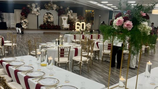 Luxury catered outdoor wedding reception in Naples, Florida featuring elegant dinnerware, ambient lighting, and gourmet plated cuisine by Creative Catering Naples.