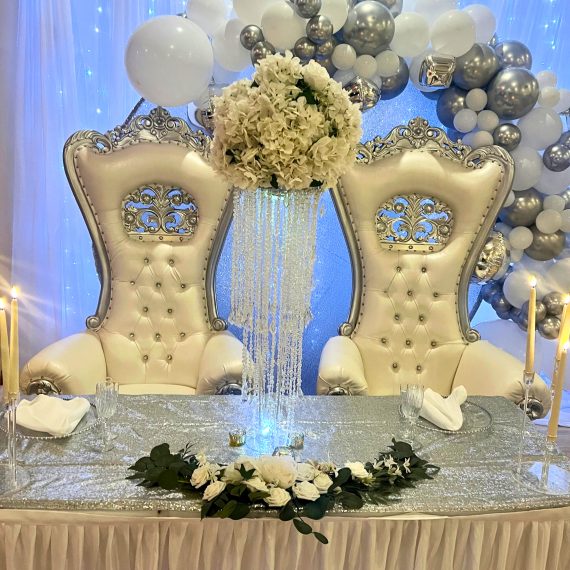 Elegant wedding reception table with floral centerpieces & plated dinner by Creative Catering Naples.