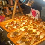 Elegant multicultural wedding catering setup in Naples, Florida, featuring chef-styled Mediterranean appetizers and tropical decor.