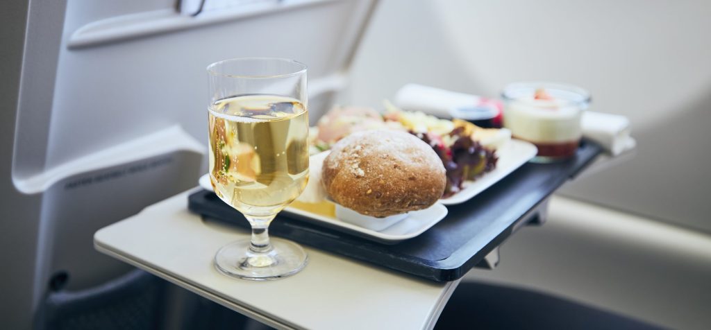 Chef-prepared in-flight catering meal plated in premium cabin-safe packaging for private jet service