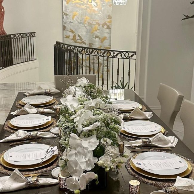 Elegant waterfront wedding reception in Naples, Florida with luxury catering setup by Creative Catering Naples featuring Mediterranean dishes and candlelit tables.