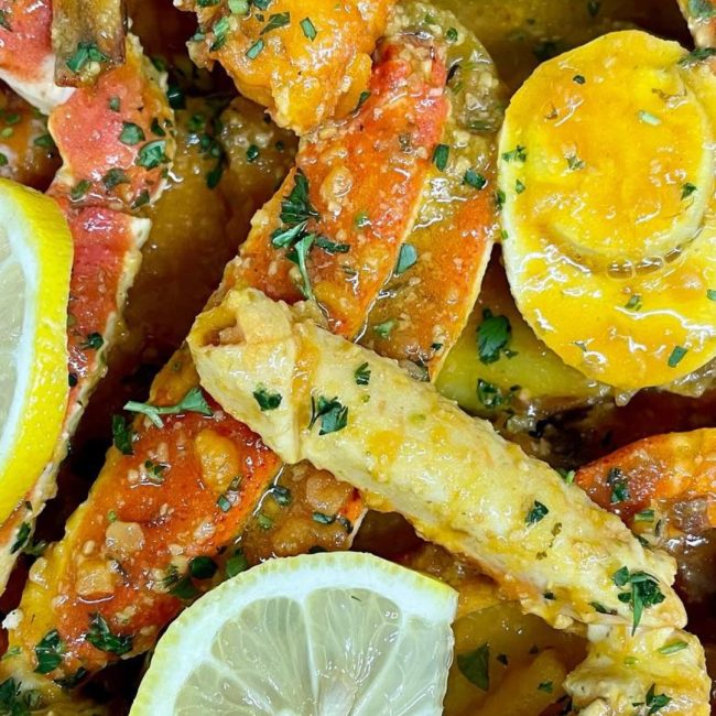 Private chef preparing fresh seafood at a luxury outdoor wedding on the waterfront in Naples, Florida