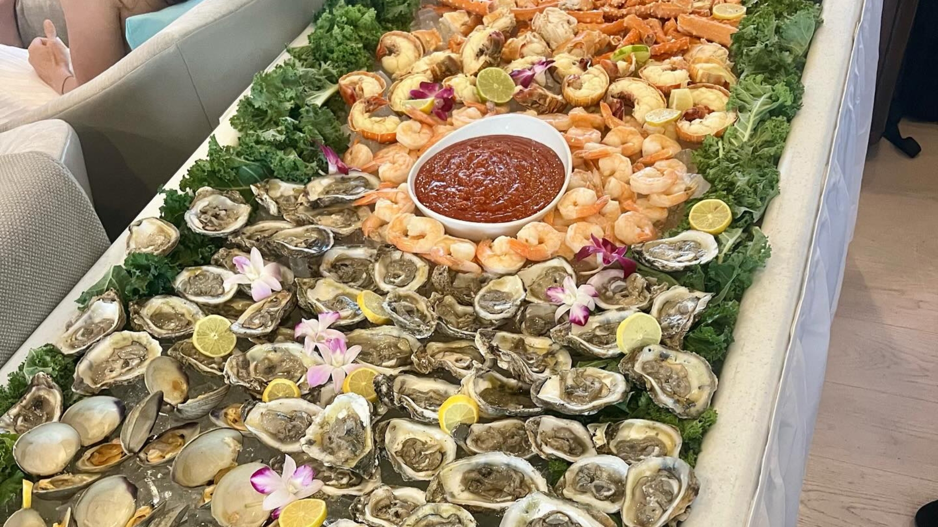 Elegant yacht party catering setup with seafood and tropical dishes near Naples, FL.