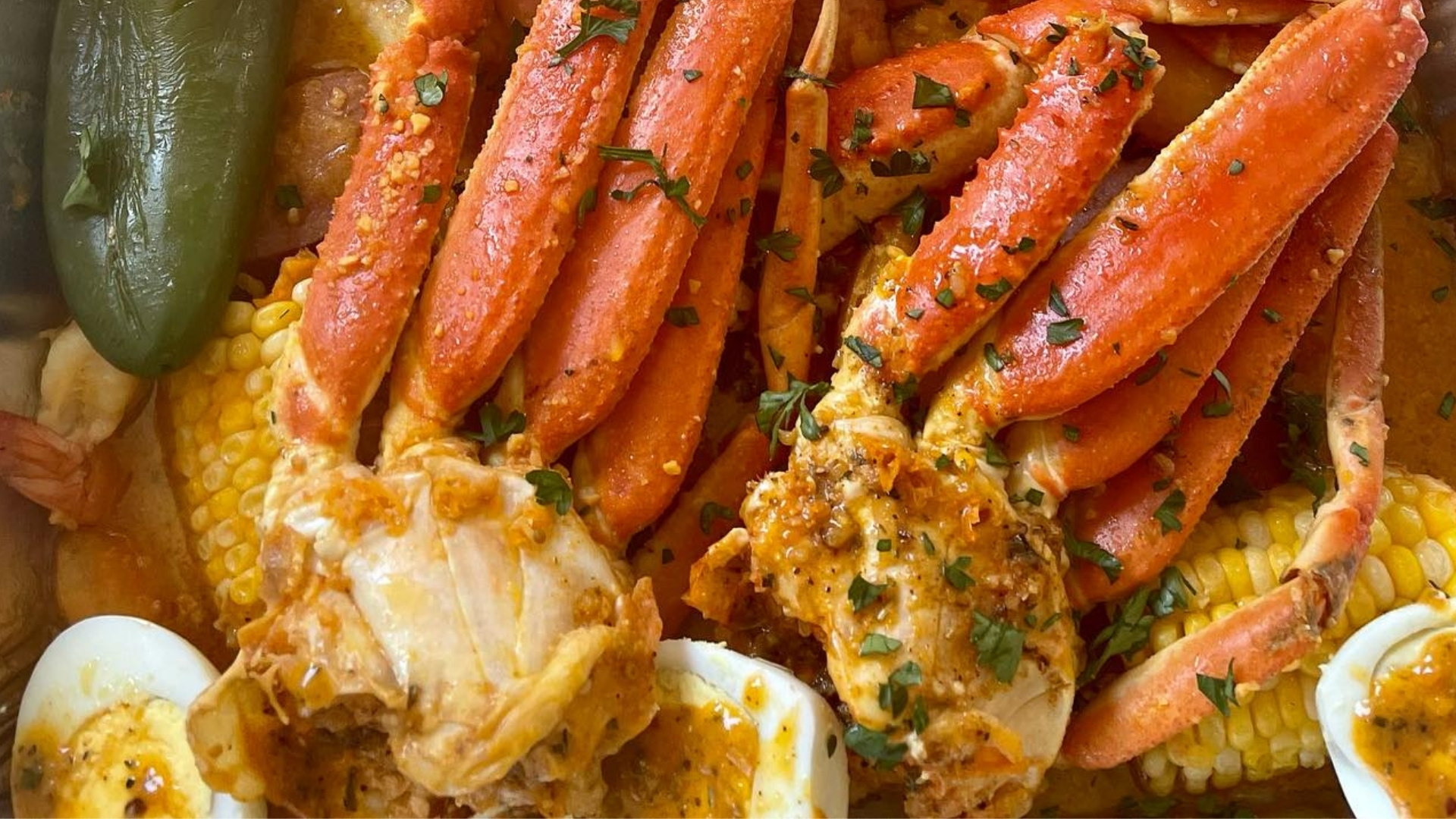 Elegant plated spring seafood dish with citrus garnish, prepared by Creative Catering Naples at a waterfront event in Naples, Florida.