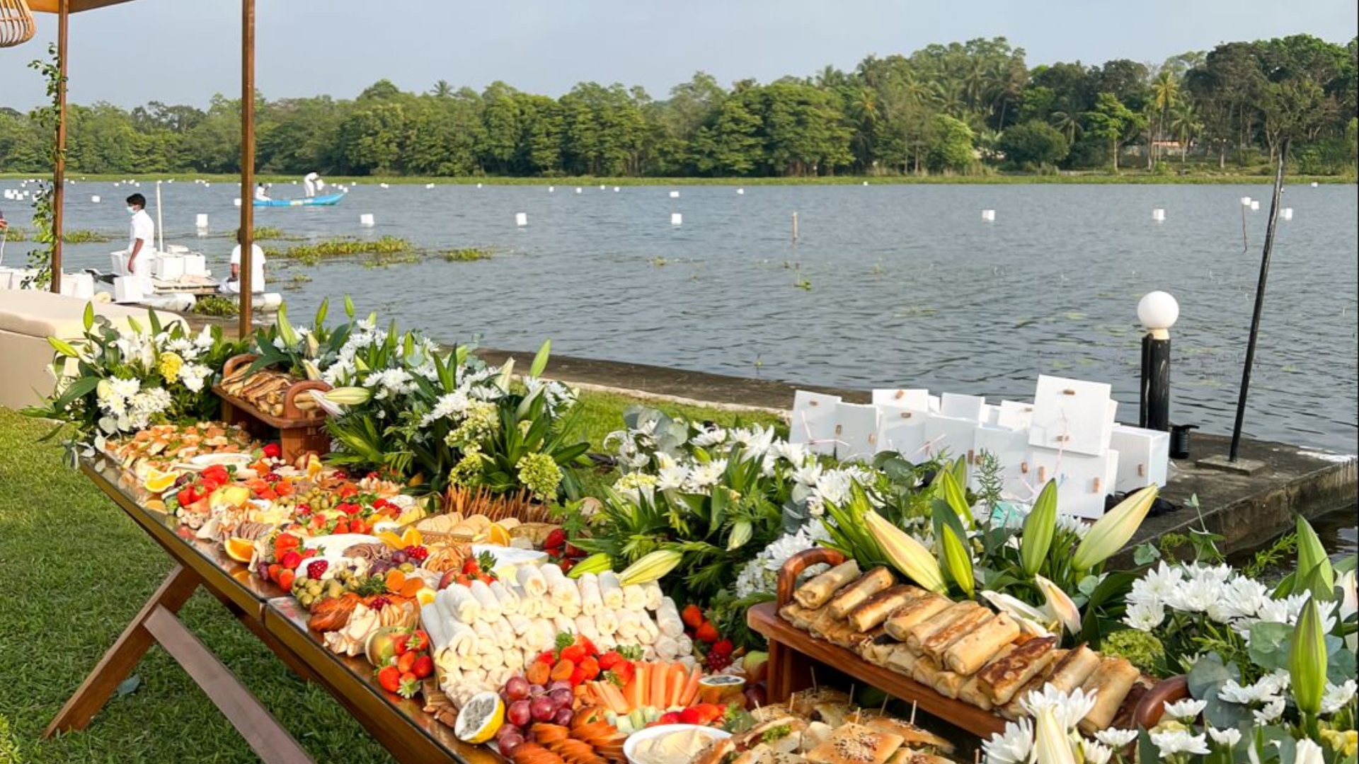 Elegant outdoor catered event by Creative Catering Naples with chef-prepared dishes and upscale table settings overlooking the Gulf Coast.