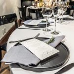 Elegant wedding table setting with gourmet plated dishes by Creative Catering Naples in a waterfront Naples, Florida venue