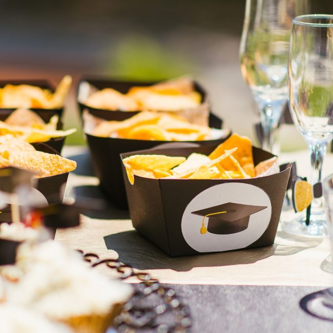 Luxury graduation catering Naples Florida by Creative Catering Naples featuring elegant buffet stations, gourmet appetizers, graduation cake display, and upscale outdoor celebration setup.