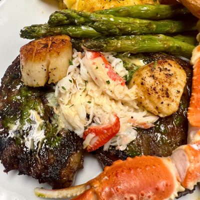 Close-up of steak and lobster plated together for Creative Catering Naples’ Surf & Turf Collection.