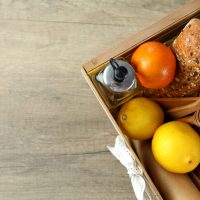 concept-of-gift-with-christmas-basket-on-wooden-ba-2025-04-01-02-53-05-utc